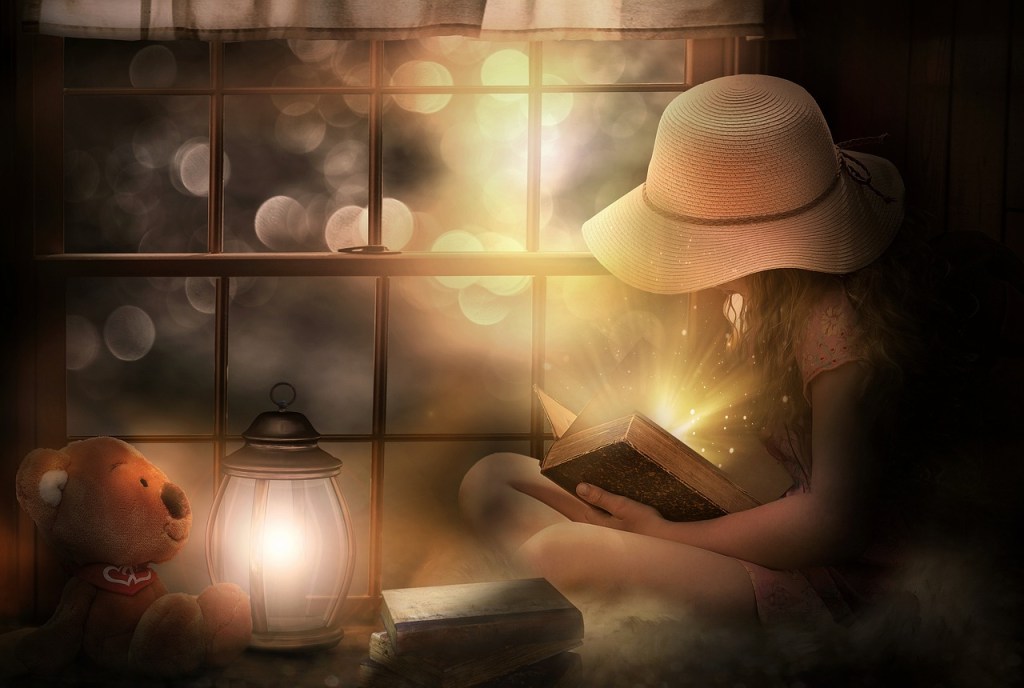 A woman in a straw hat reading a book, surrounded by light orbs